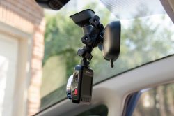 Mirror clamp locks onto your rear view mirror arm.